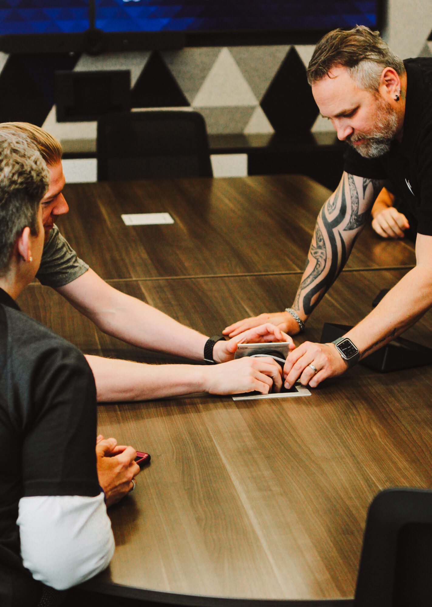 Corporate office finance and IT teams reviewing AV budget forecast with managed services spend