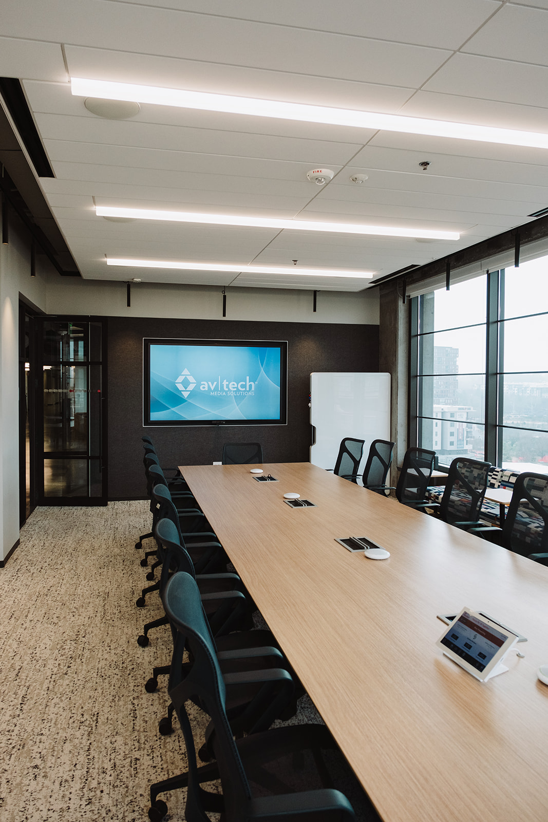 Boardroom AV system being inspected as part of a proactive maintenance check